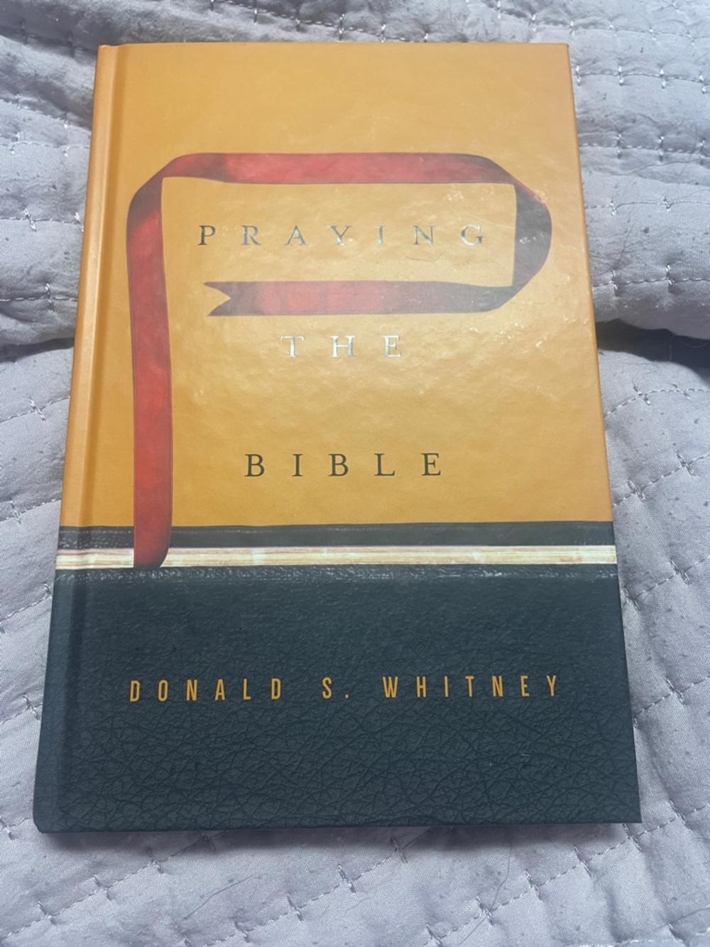 Praying the Bible by Donald S. Whitney - Orange & Black Cover